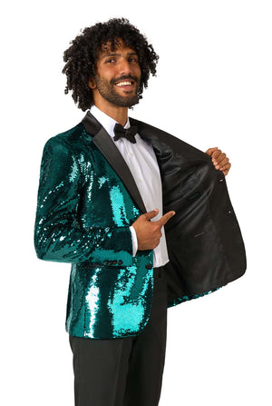 Man draagt een blauwgroene blazer met pailletten en zwarte satijnen revers.
