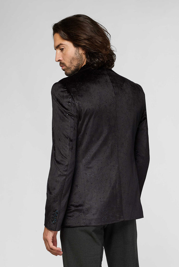 Zwart jas met sterrenbeeld Patroon gedragen door de mens met de achterkant van de jas