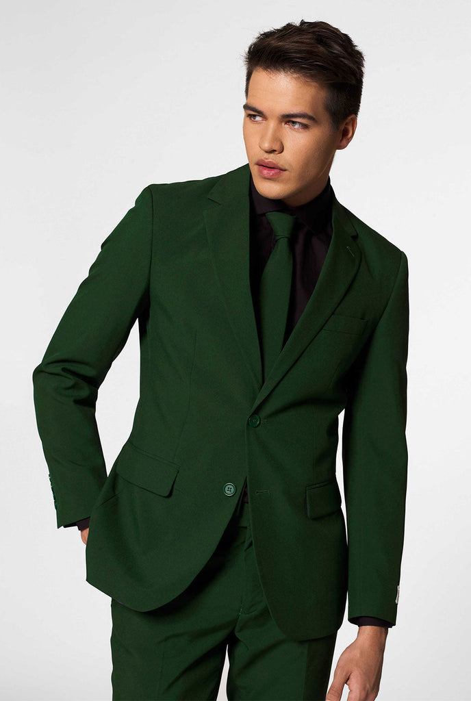 Vaste kleur donkergroene herenpak glorieus groen gedragen door mannen ingezoomd
