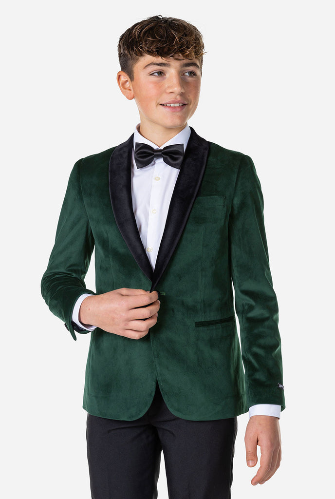 Tiener met groen fluwelen kerstdiner jas