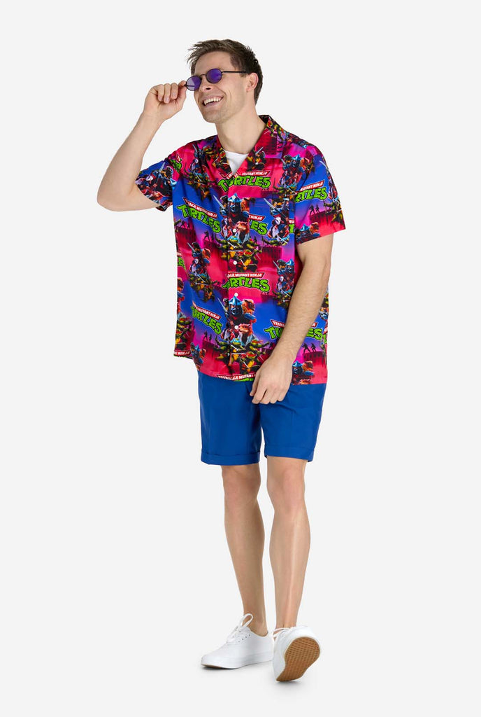 Man wearing Hawaiian Shirt with Teenage Mutant Ninja Turtle print.
