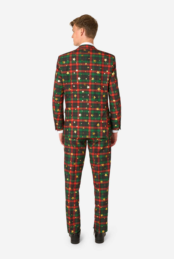 Achteraanzicht van een man in een rood-groen tartan ruitpak met gouden sterren- en stipaccenten.