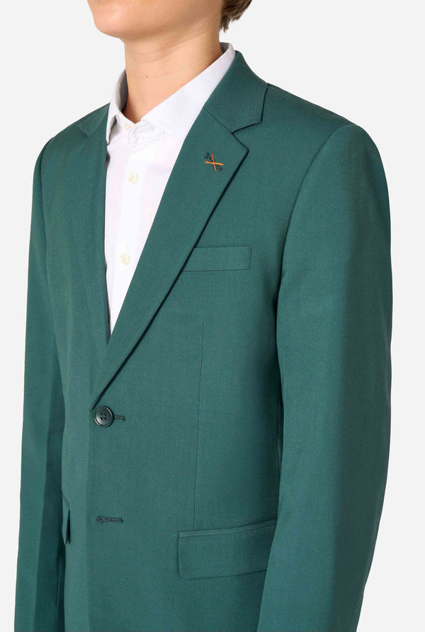 Teen boy wearing a stylish dark green suit with a white dress shirt, smiling confidently. Perfect formal outfit for boys' special occasions, weddings, and parties. Chest close-up.