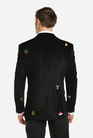 Man met zwarte kerstblazer met kerstpictogrammen, zicht vanaf de achterkant