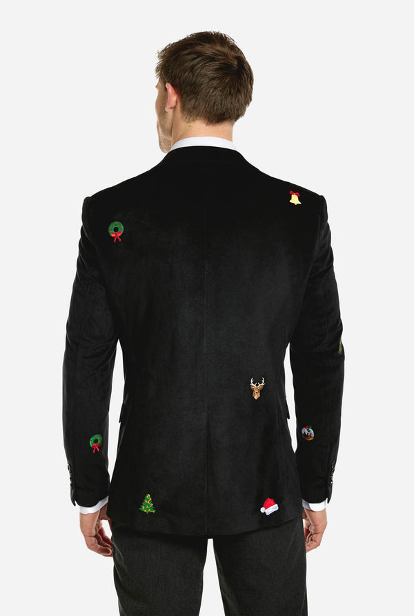 Man met zwarte kerstblazer met kerstpictogrammen, zicht vanaf de achterkant