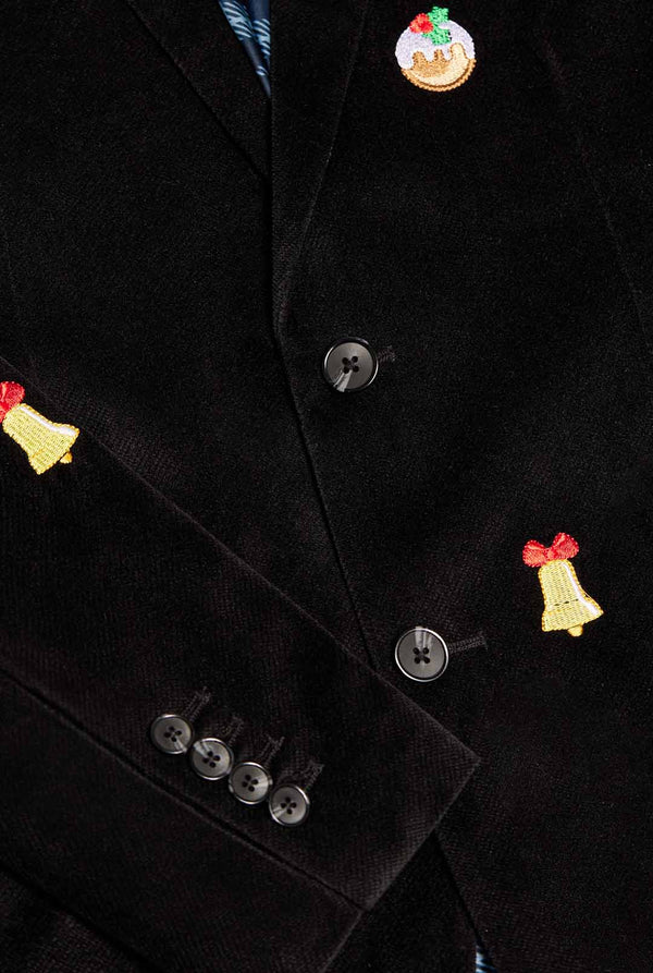 Zwarte kerstblazer met kerstpictogrammen, close up