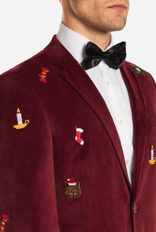 Man draagt bordeaux rode dinner jacket blazer met Kerst icoontjes