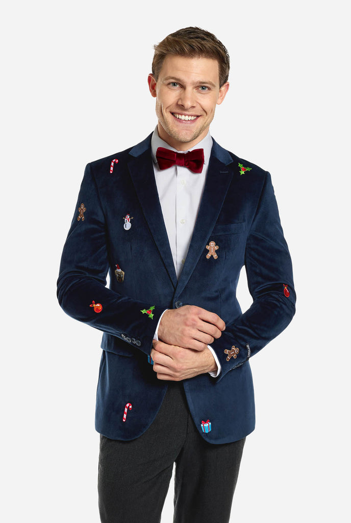 Man draagt blauwe dinner jacket blazer met Kerst icoontjes