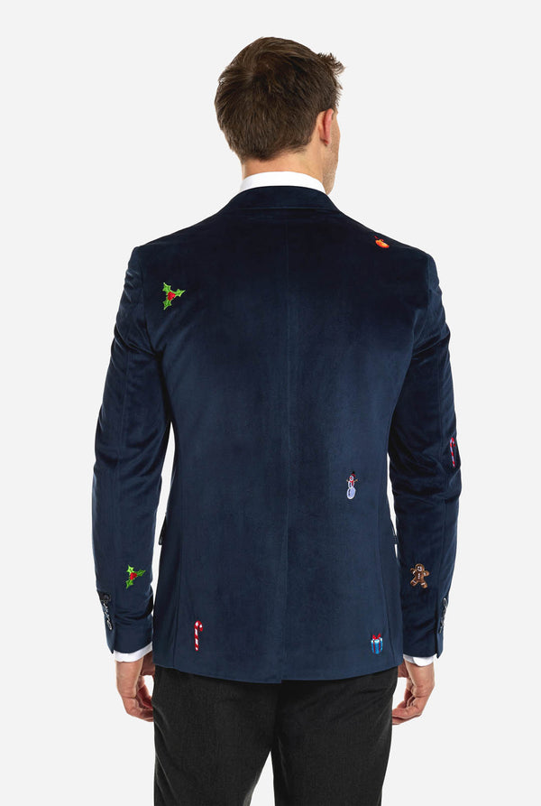 Man draagt blauwe dinner jacket blazer met Kerst icoontjes
