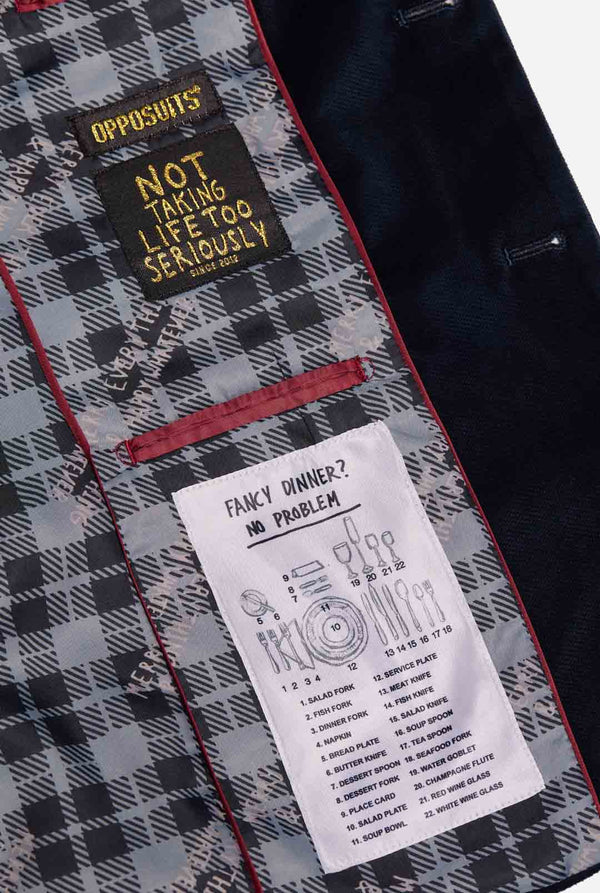 Man draagt blauwe dinner jacket blazer met Kerst icoontjes