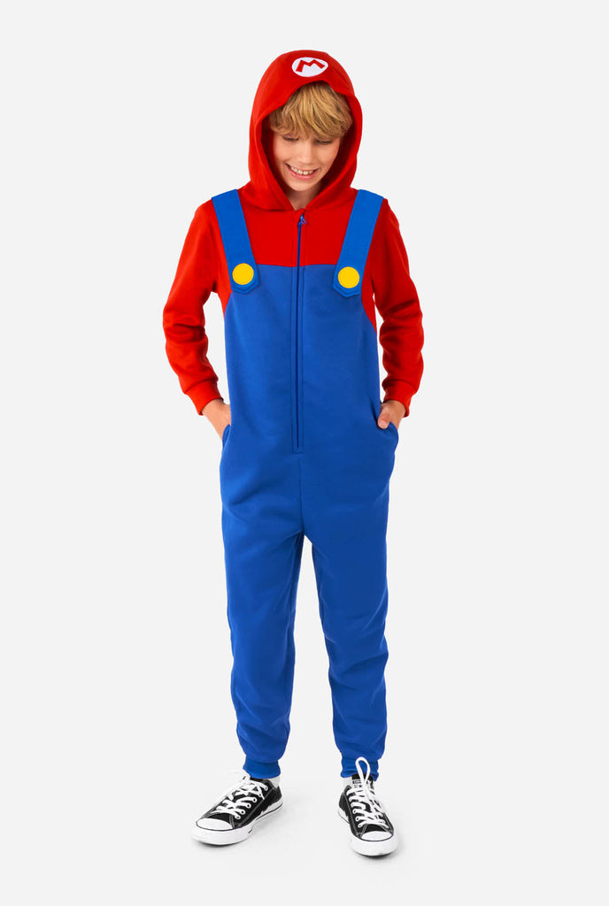 Boy wearing kids onesie with Super Mario print.