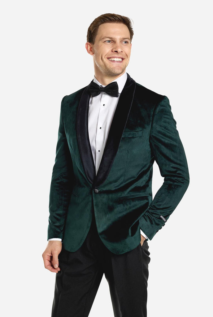 Man draagt groene dinner jacket blazer