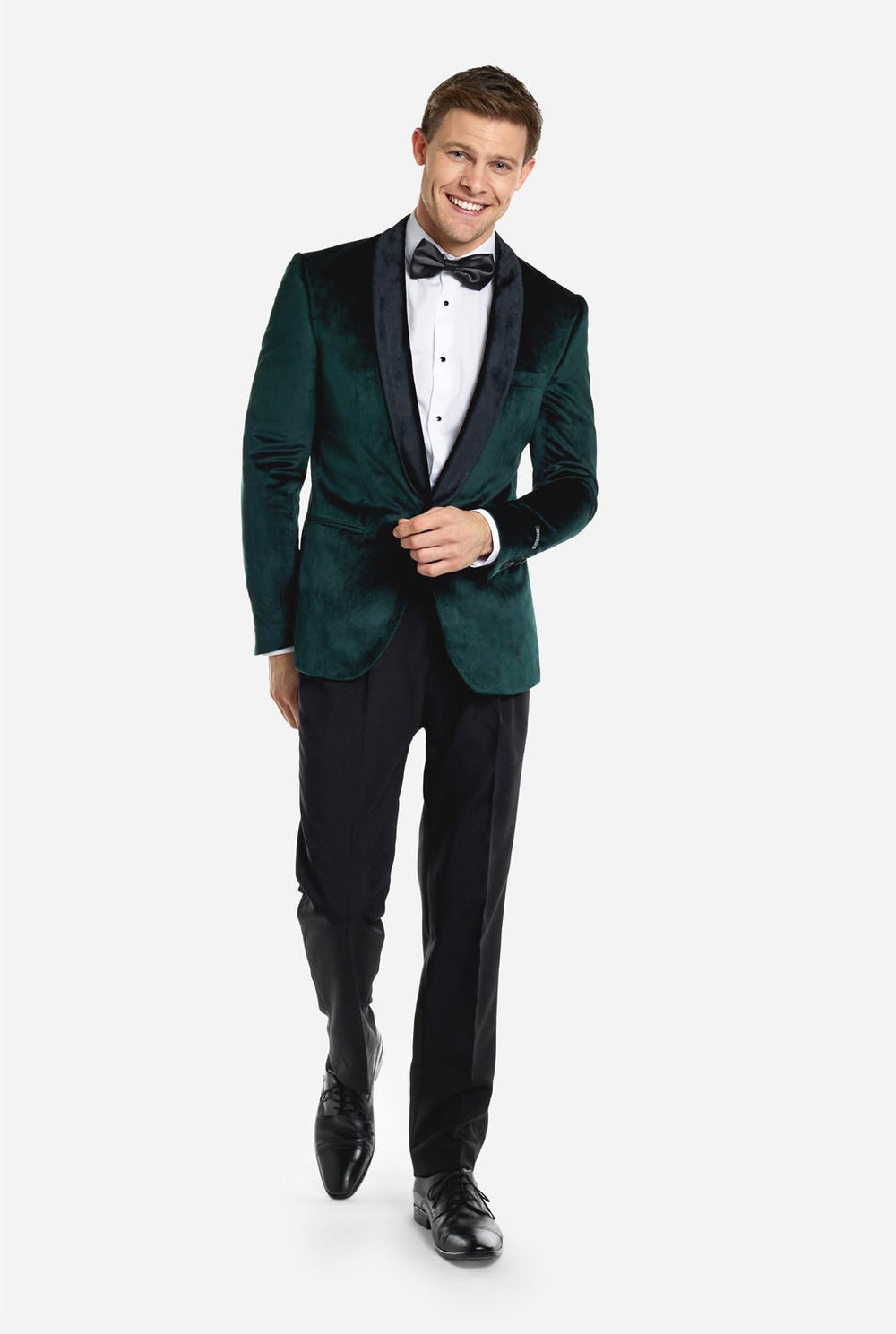 Man draagt groene dinner jacket blazer