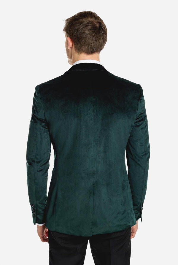 Man draagt groene dinner jacket blazer
