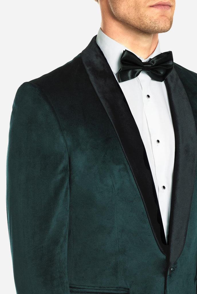 Man draagt groene dinner jacket blazer