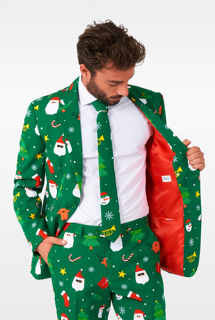 Man wearing green Christmas suits for men with Christmas icons