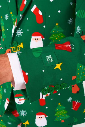 Man met groene kerstpakken voor mannen met kerstpictogrammen, close-up