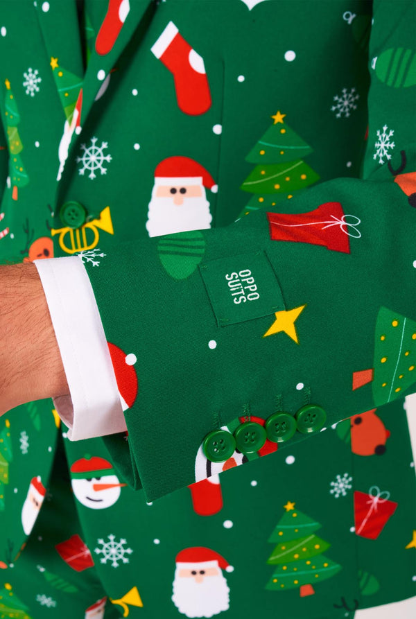 Man met groene kerstpakken voor mannen met kerstpictogrammen, close-up