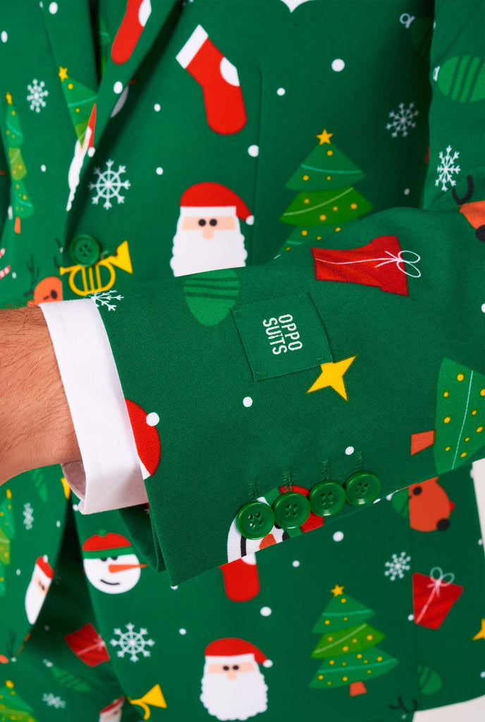 Man wearing green Christmas suits for men with Christmas icons, close up