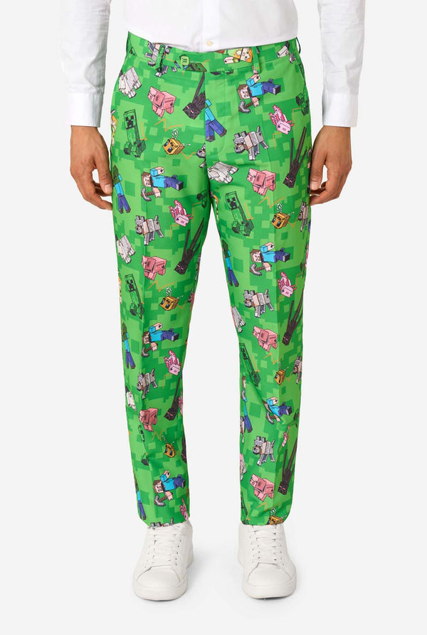 Close-up van een Minecraft-pakbroek met Creepers, varkens en wolven in een pixelachtige print.
