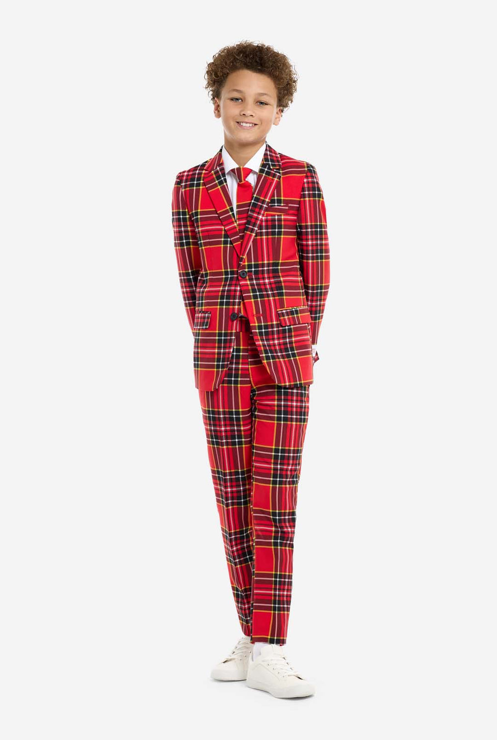 Tiener met een rood tartan kerstpak