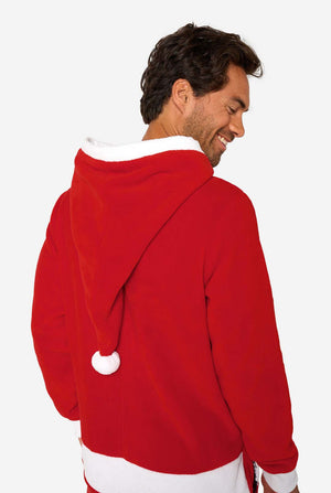 Man draagt rode Kerstman onesie.
