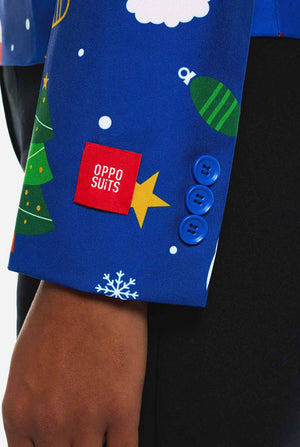 Vrouw draagt blauwe Kerstblazer voor dames, met Kersticonen.