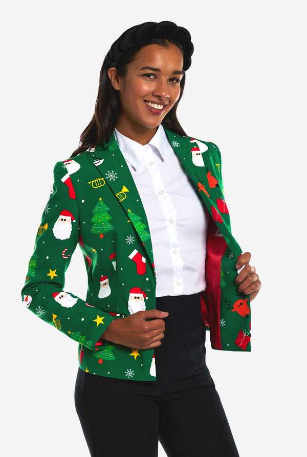 Vrouw draagt groene Kerstblazer voor dames.