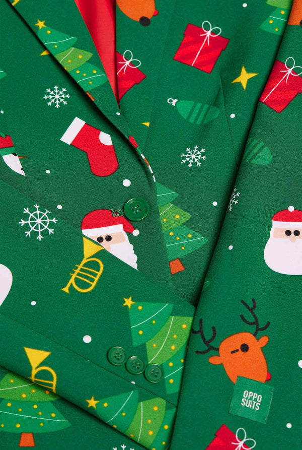 Vrouw draagt groene Kerstblazer voor dames.