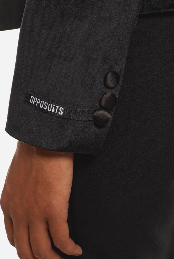 Vrouw draagt zwarte velvet dinner jacket blazer