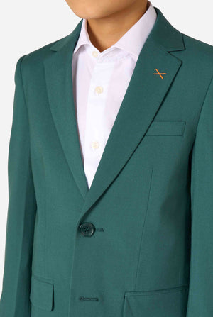 Een kind in een stijlvol donkergroen pak met een wit overhemd, wegkijkend van de camera. Perfecte formele outfit voor speciale gelegenheden, bruiloften en feestjes voor jongens. Close up van de borst.