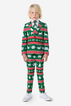 Kind draagt ​​groen kerstpak