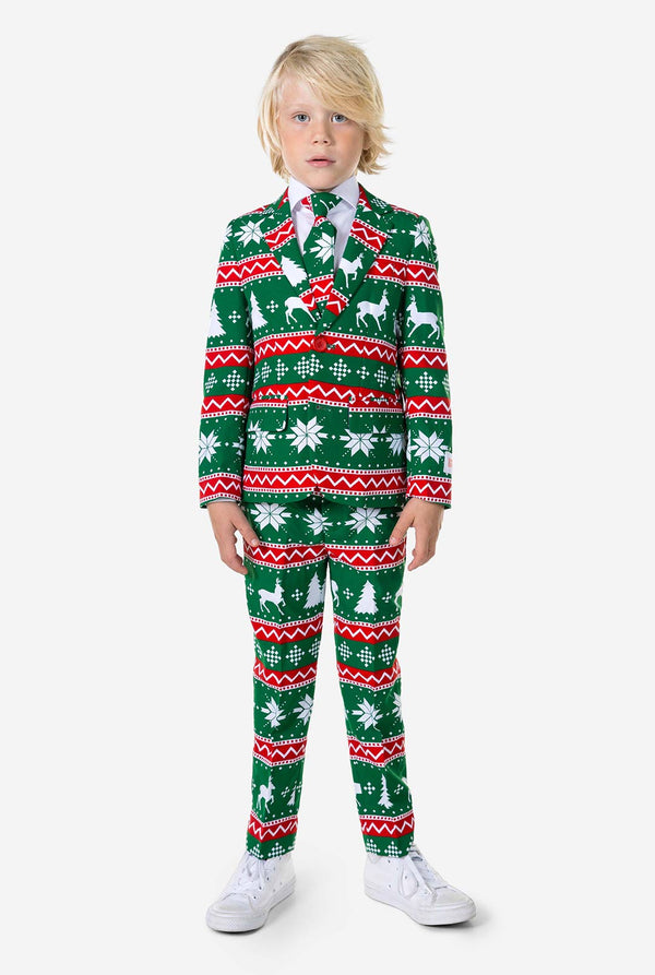 Kind draagt ​​groen kerstpak
