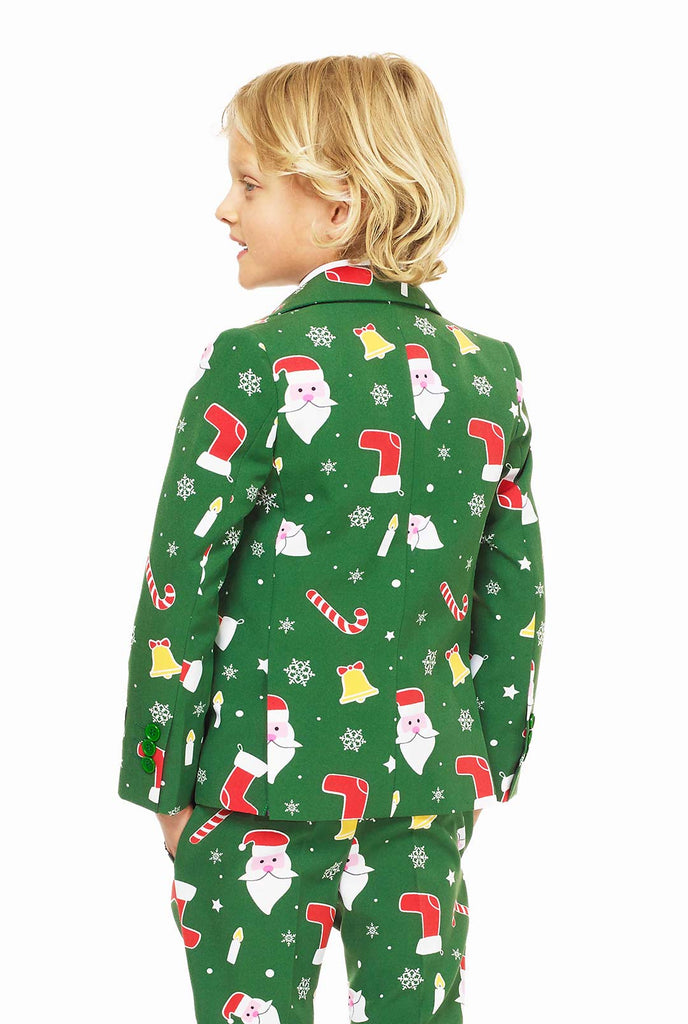 Groen kerstpak voor jongens met kerstcartooniconen gedragen door een jongen van achteren