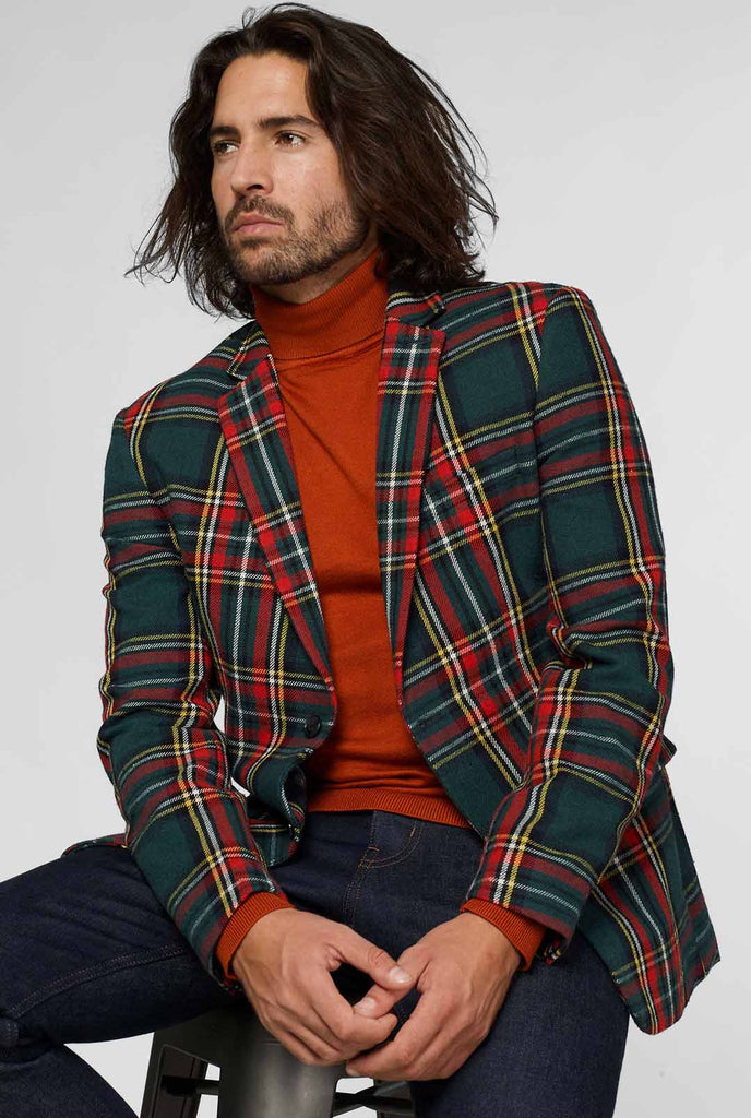 Rode en groene tartan blazer gedragen door de mens, uitzicht vanaf de achterkant