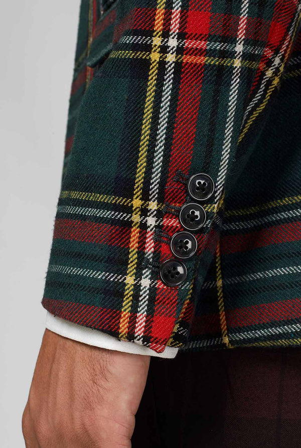 Rode en groene tartan blazer gedragen door de mens, mouw close -up
