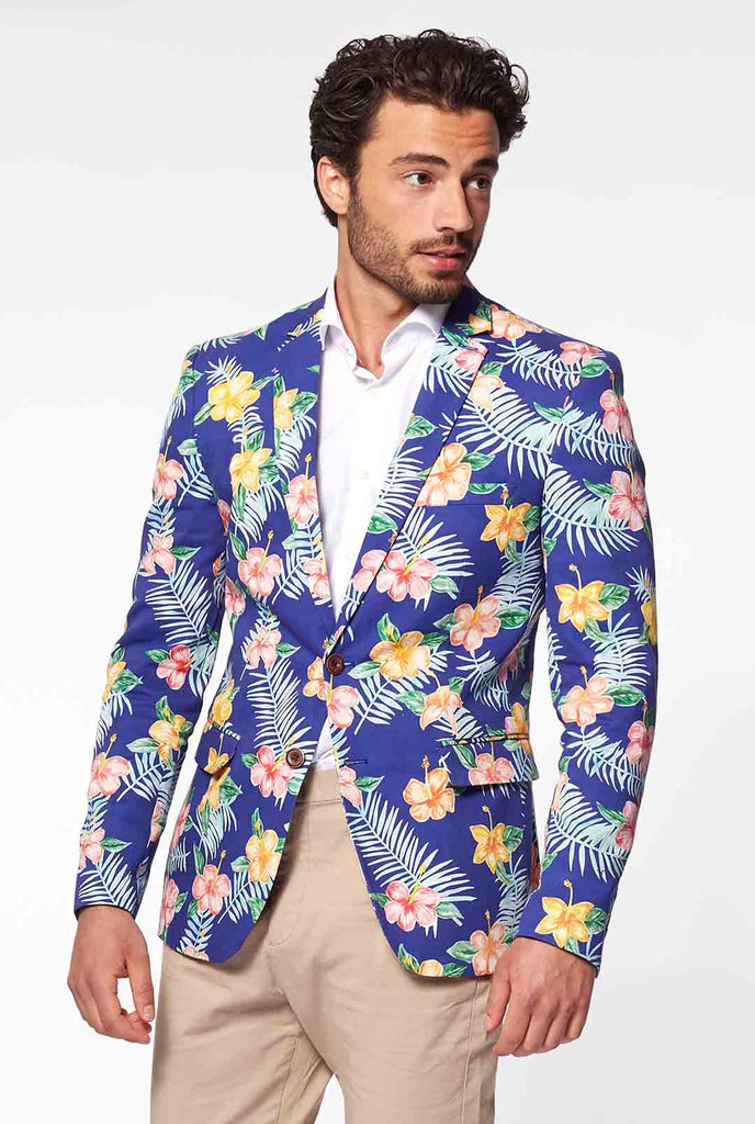 Blauwe casual blazer met bloemenprint gedragen door de mens vanaf de achterkant