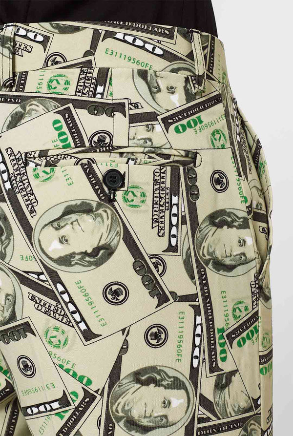 Man draagt ​​herenpak met dollar, geldprint, broek close -up