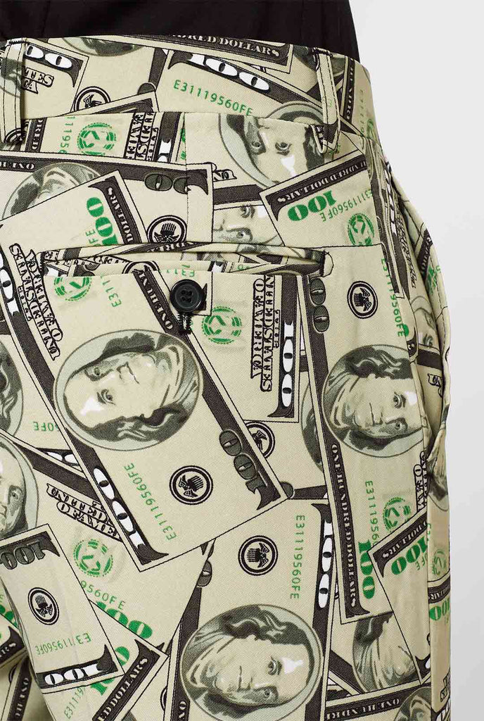 Man draagt ​​herenpak met dollar, geldprint, broek close -up