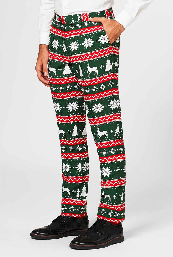 Groene en rode kerstthema -broek gedragen door de mens