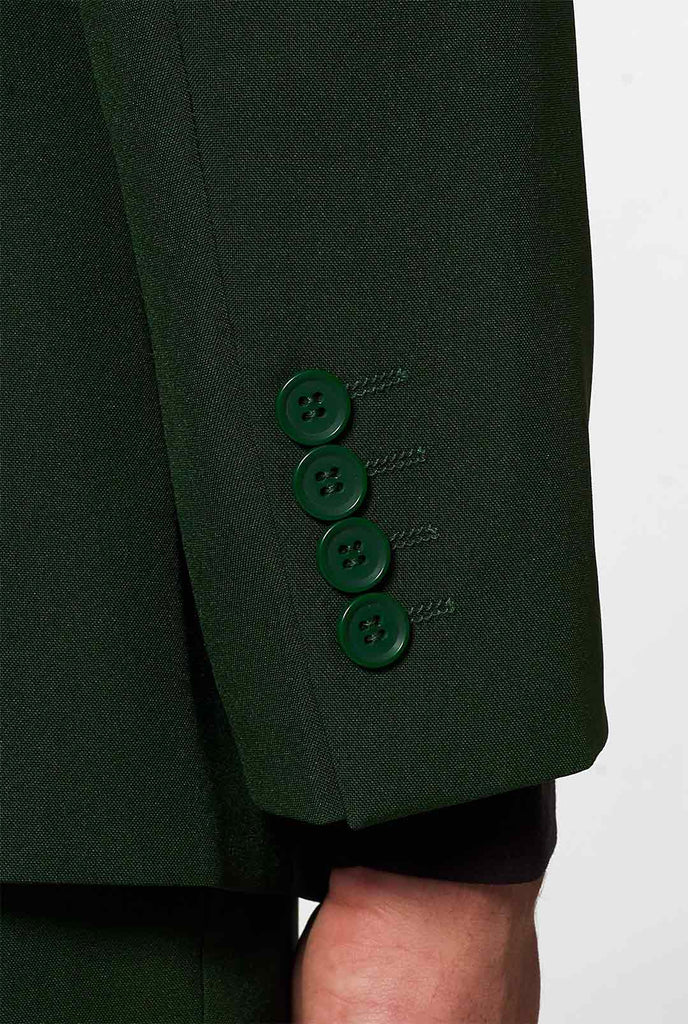 Massief donkergroen pak glorieus groen gedragen door herenhuls detail met groene knoppen