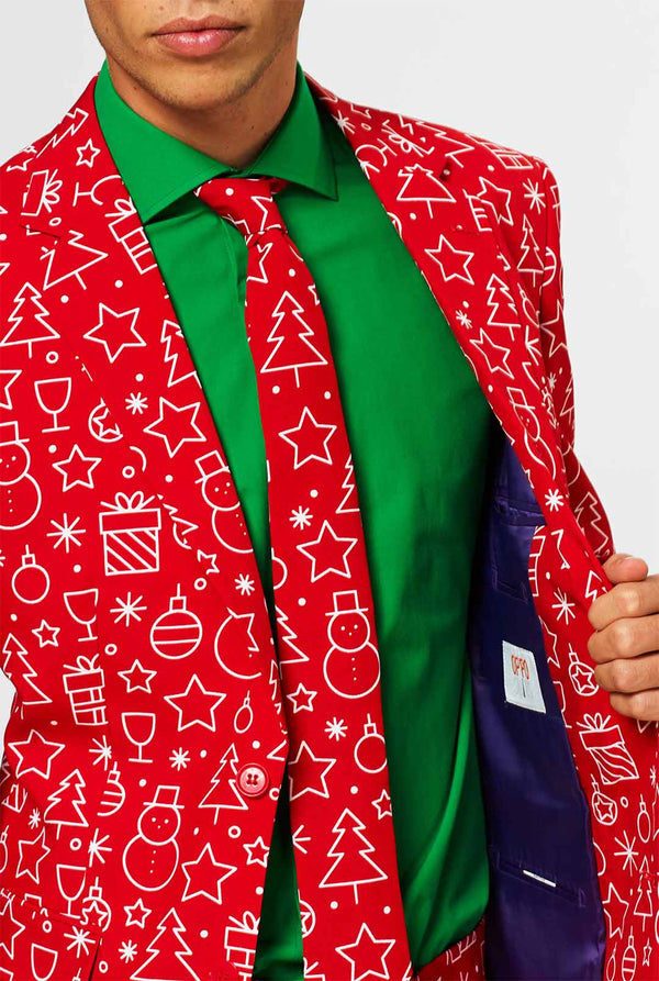 Rood kerstpak met kerstdruk gedragen door de mens
