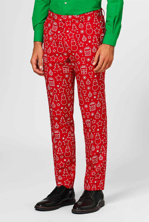 Rood kerstpak met kerstdruk gedragen door de mens