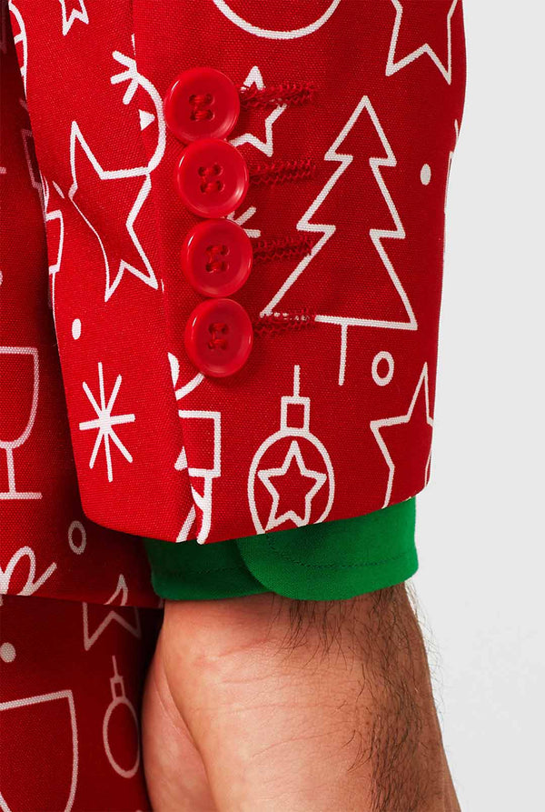Rood kerstpak met kerstdruk gedragen door de mens