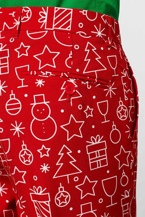 Rood kerstpak met kerstdruk gedragen door de mens