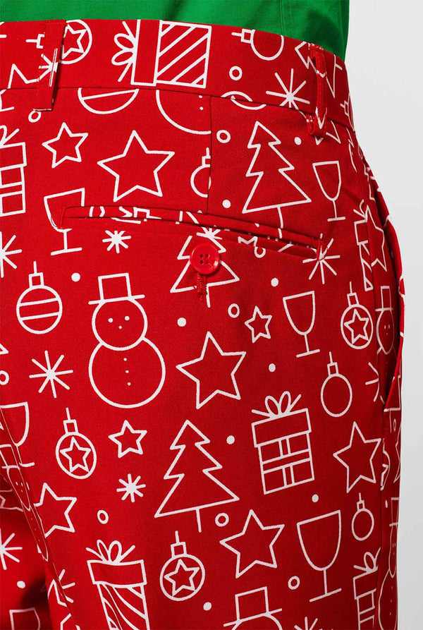 Rood kerstpak met kerstdruk gedragen door de mens