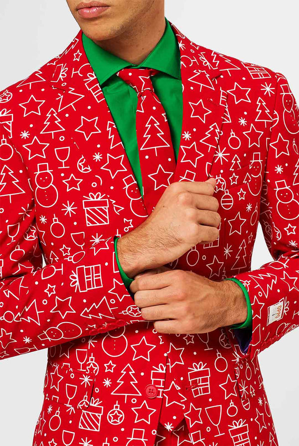 Rood kerstpak met kerstdruk gedragen door de mens