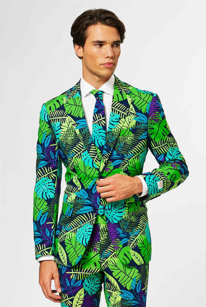 Jungle print herenpak met groene en paarse bladafdruk gedragen door de mens