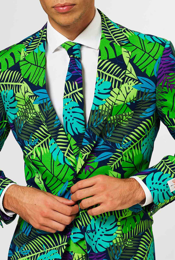 Jungle print herenpak met groene en paarse bladafdruk gedragen door de mens