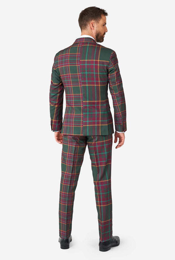 Man draagt ​​een tartan plaid kerstpak, uitzicht vanaf de achterkant